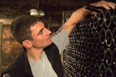 Xavier Durand Taking Bottle in Cellers